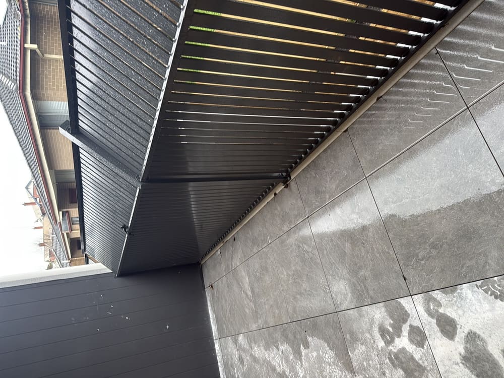 Balustrade fixings may have compromised waterproofing, recorded during a waterproofing inspection in Lilydale